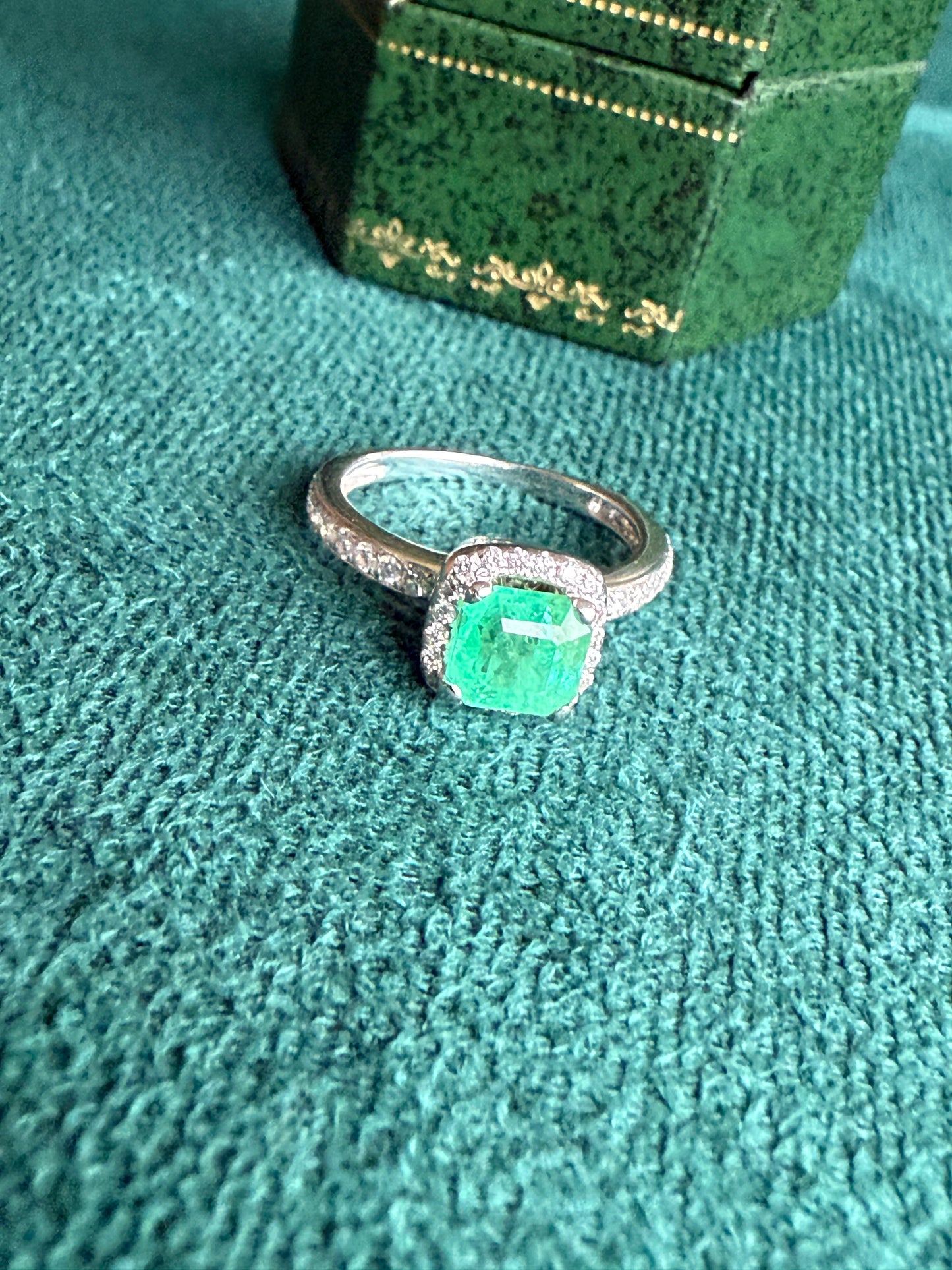 18ct gold emerald and diamond halo ring