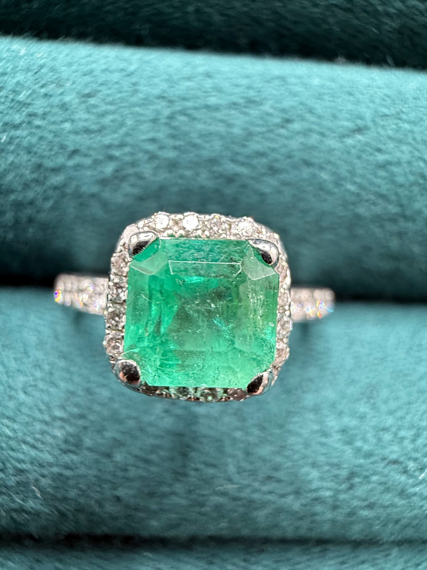 18ct gold emerald and diamond halo ring