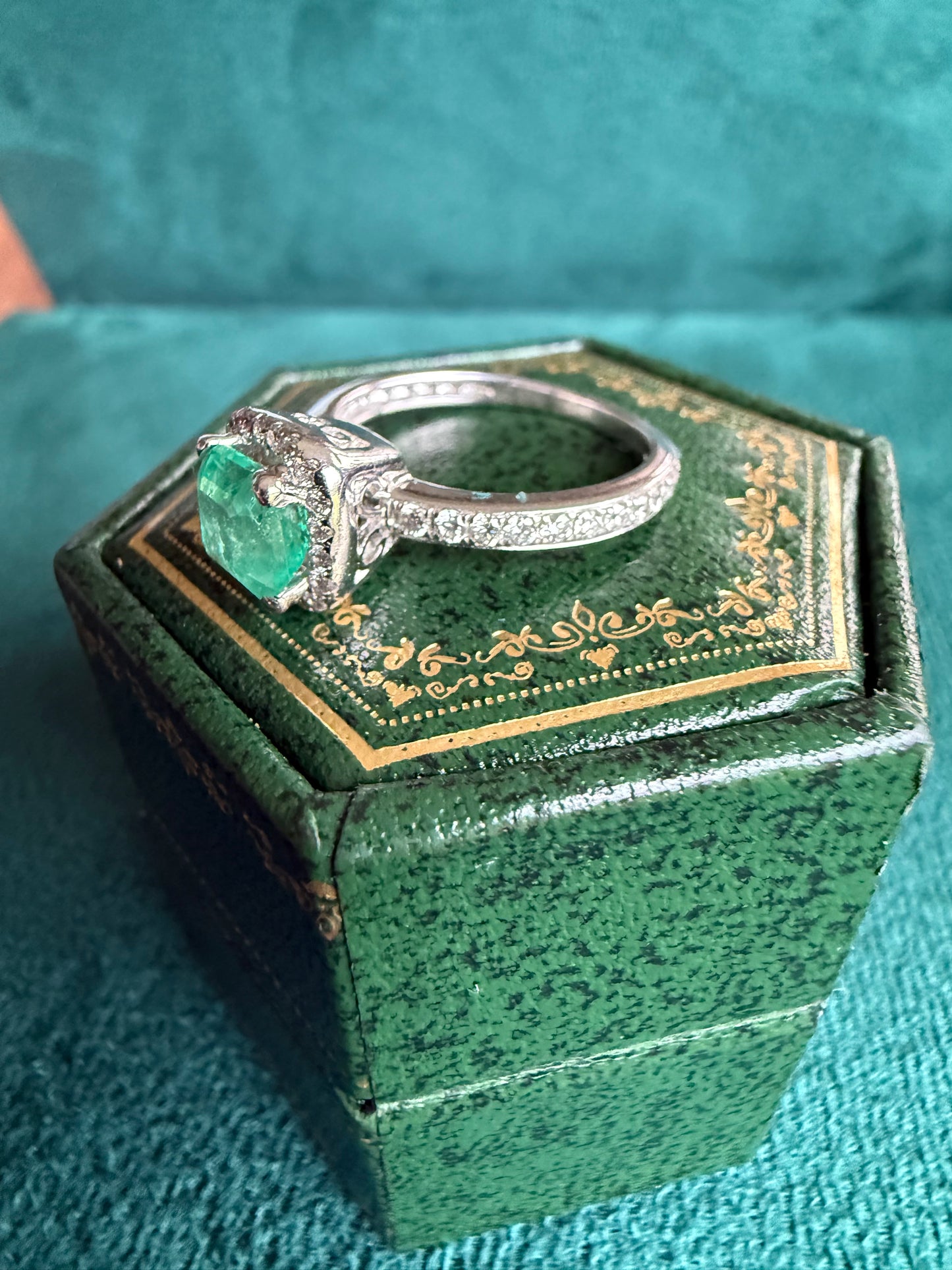 18ct gold emerald and diamond halo ring