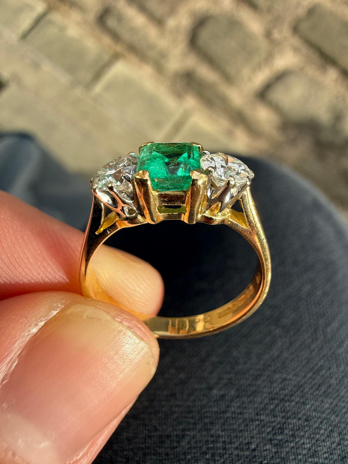 18ct gold emerald and diamond three stone ring