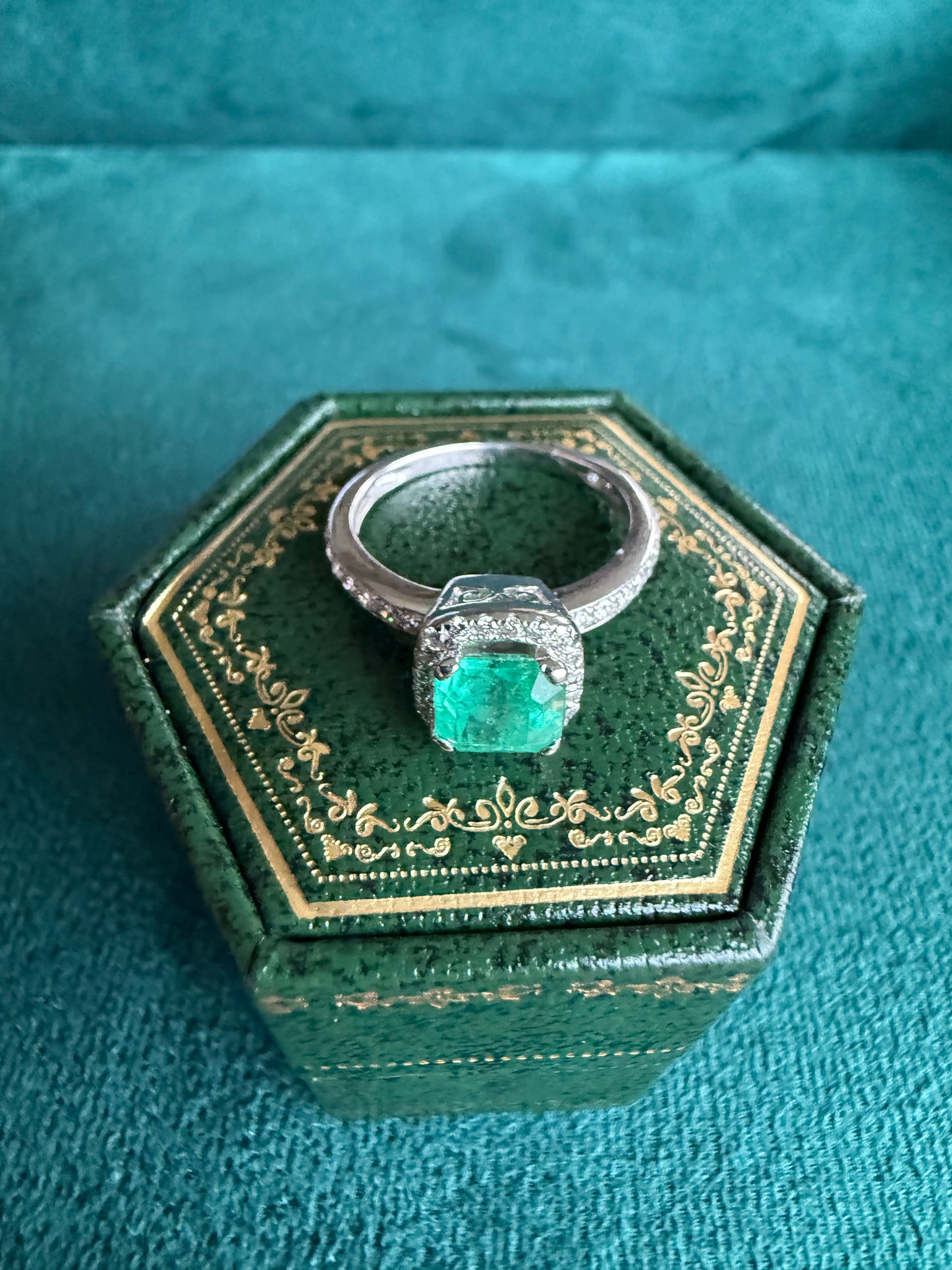 18ct gold emerald and diamond halo ring