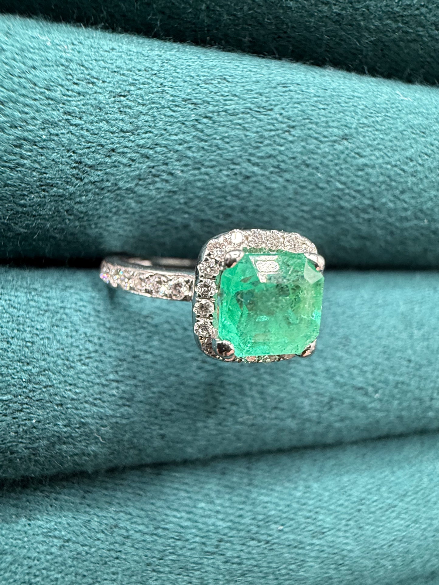 18ct gold emerald and diamond halo ring
