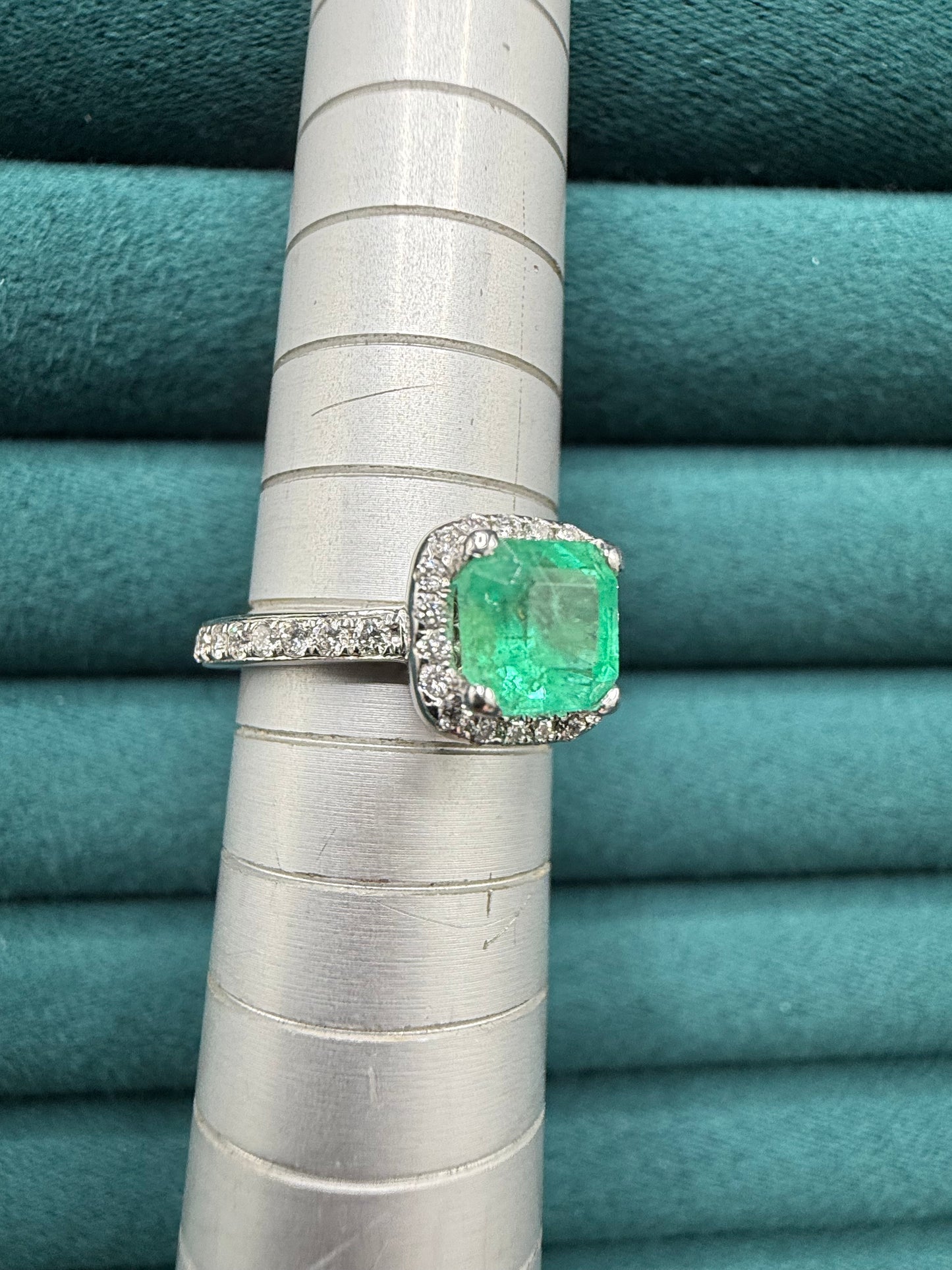 18ct gold emerald and diamond halo ring