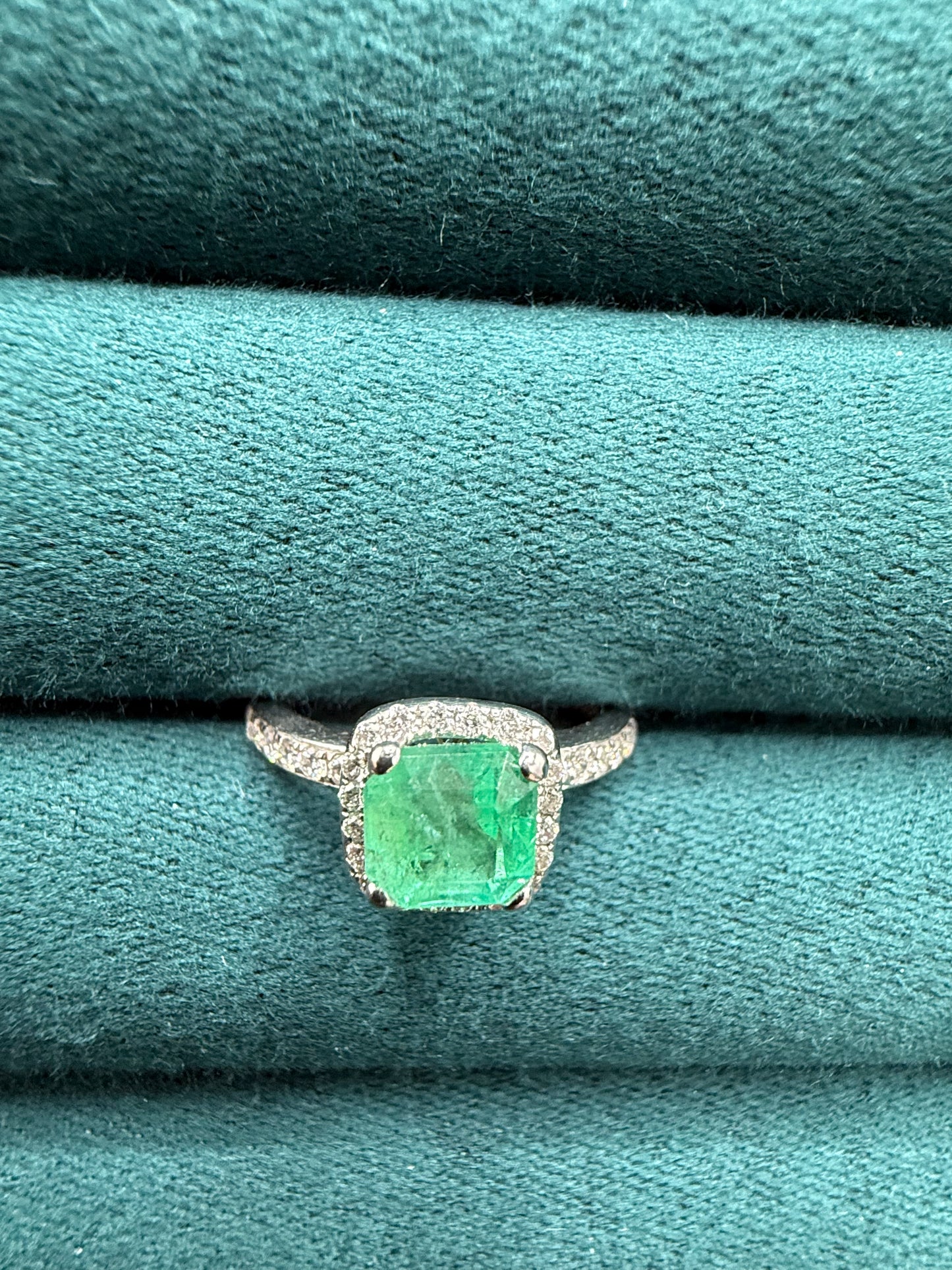 18ct gold emerald and diamond halo ring