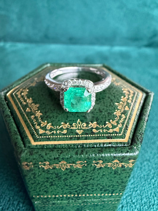 18ct gold emerald and diamond halo ring
