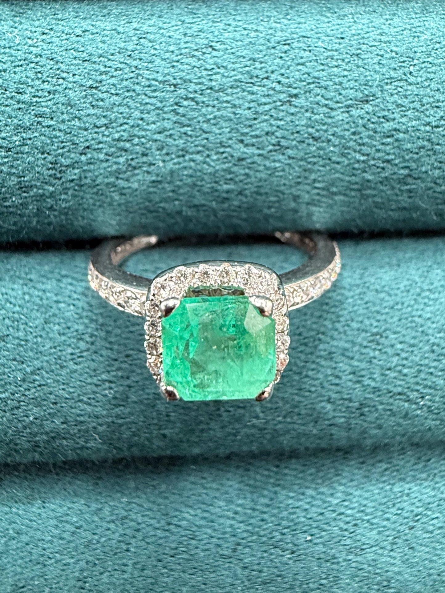 18ct gold emerald and diamond halo ring