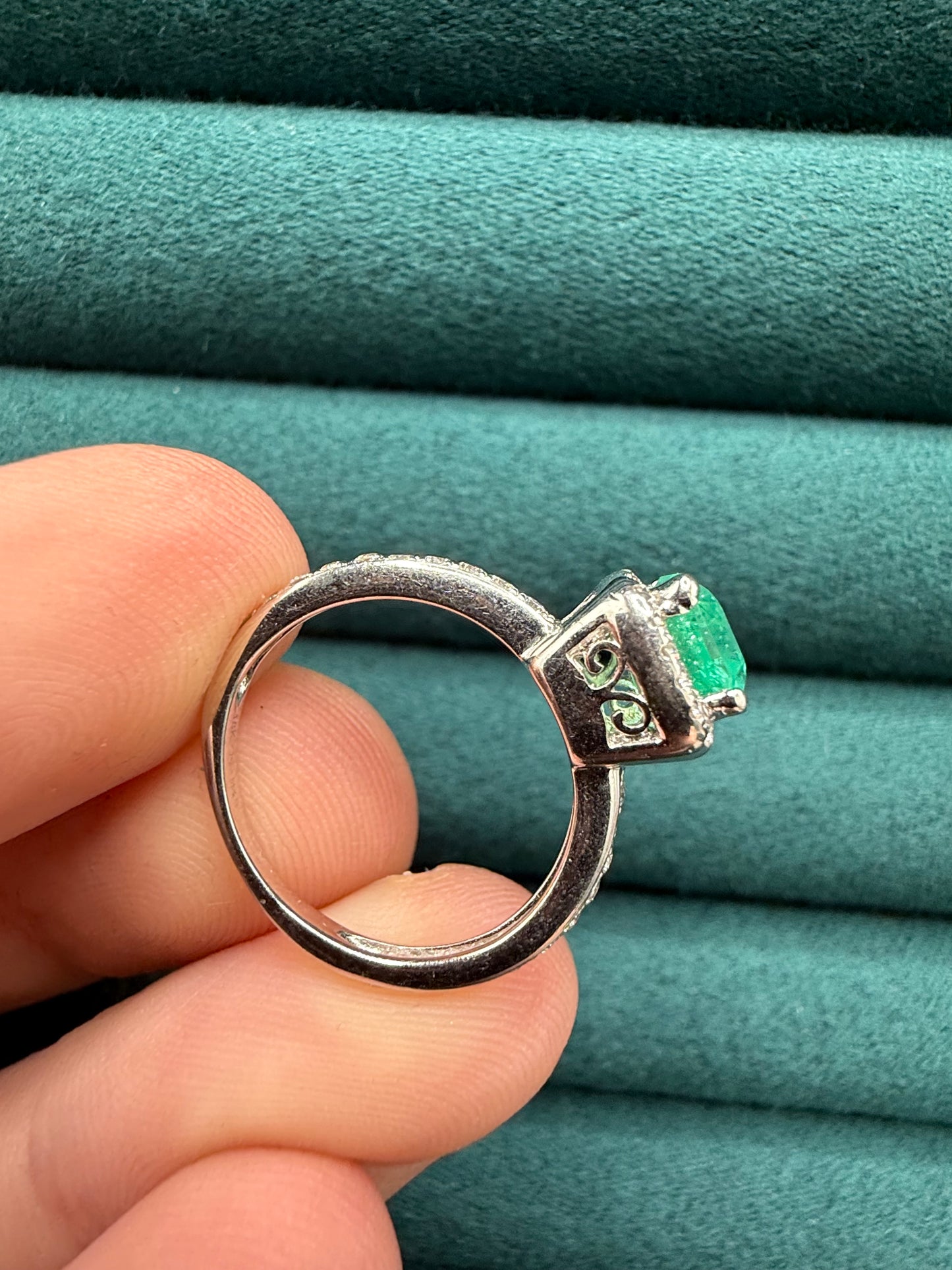 18ct gold emerald and diamond halo ring