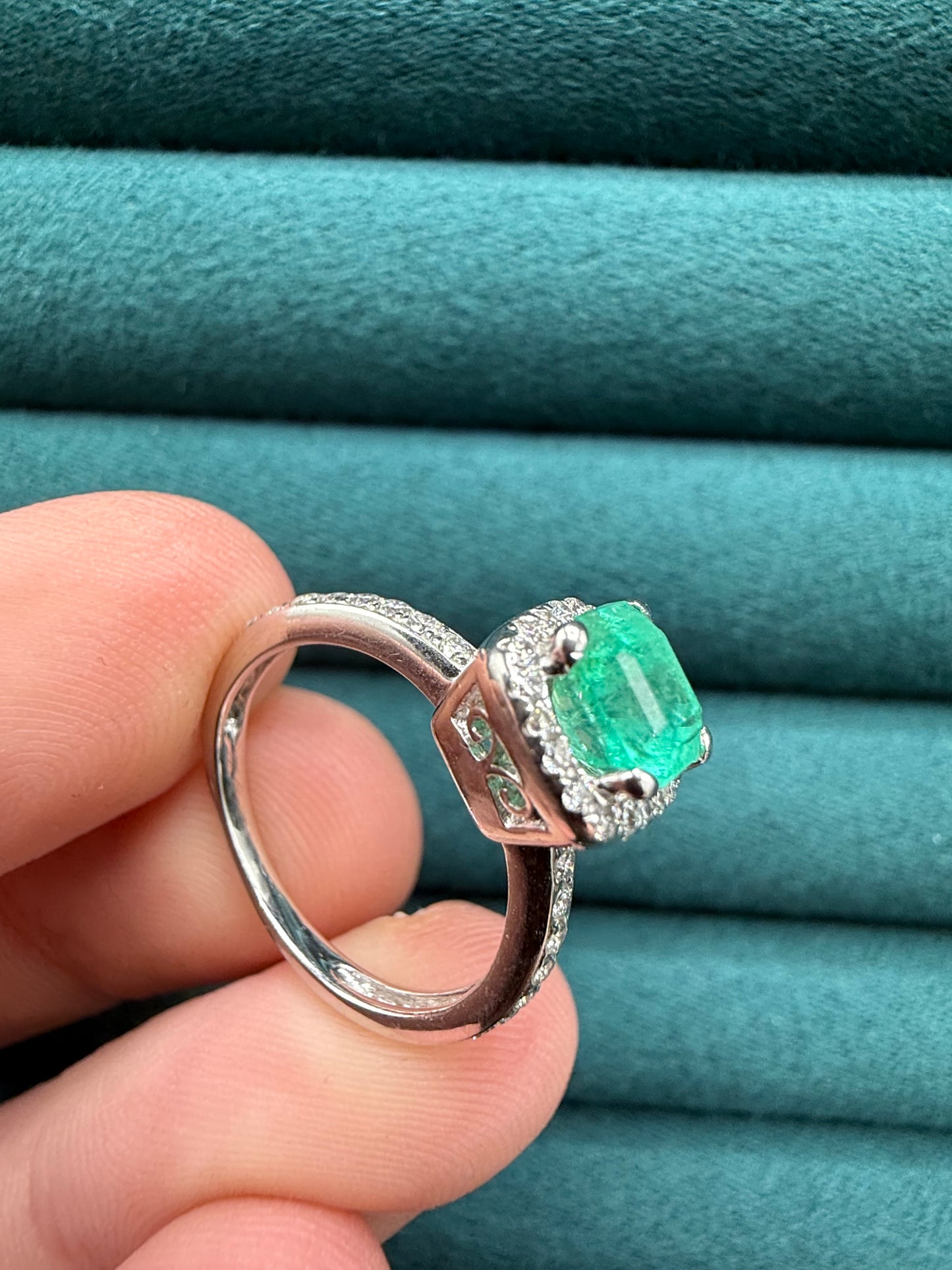 18ct gold emerald and diamond halo ring