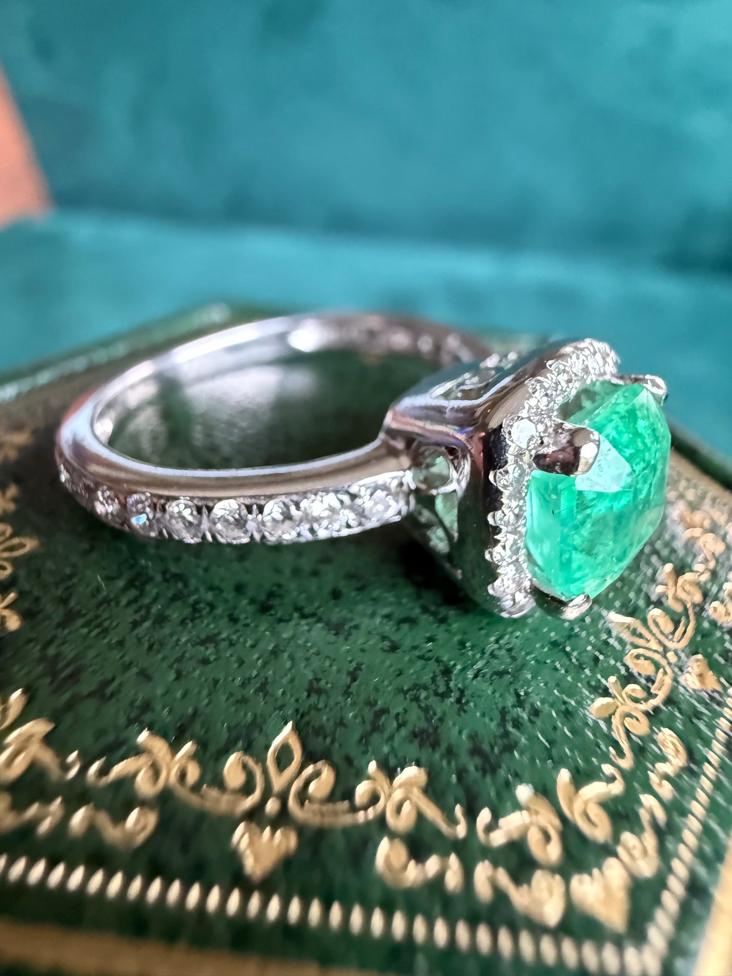 18ct gold emerald and diamond halo ring