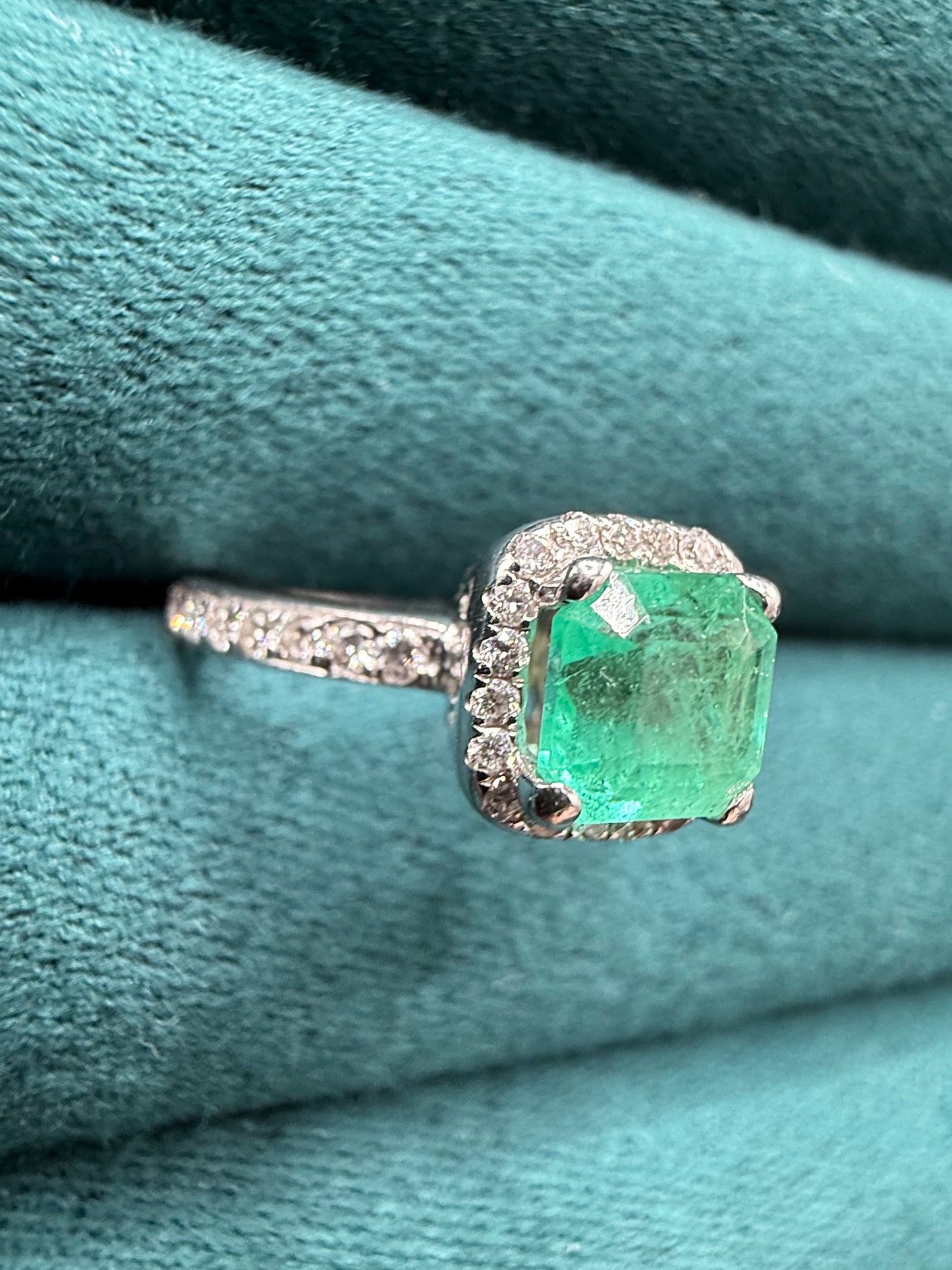 18ct gold emerald and diamond halo ring