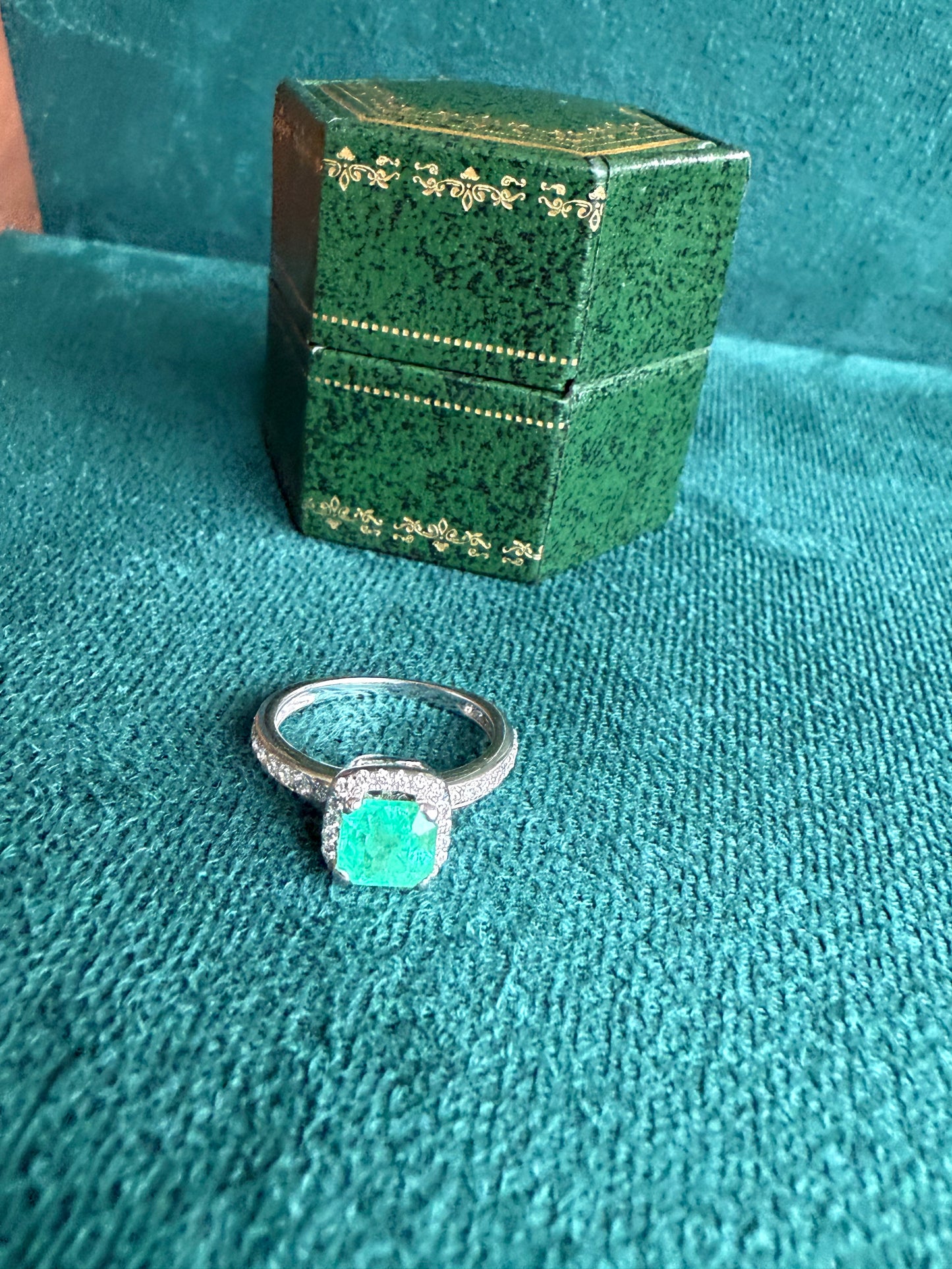 18ct gold emerald and diamond halo ring