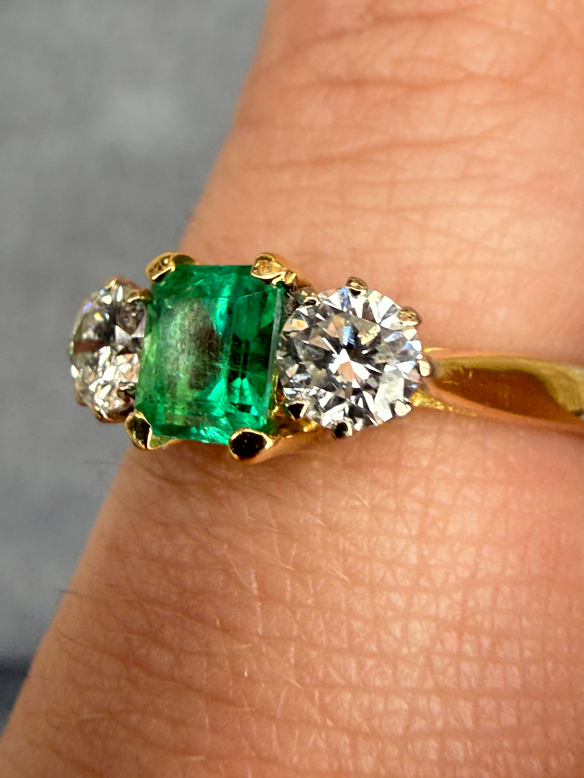 18ct gold emerald and diamond three stone ring